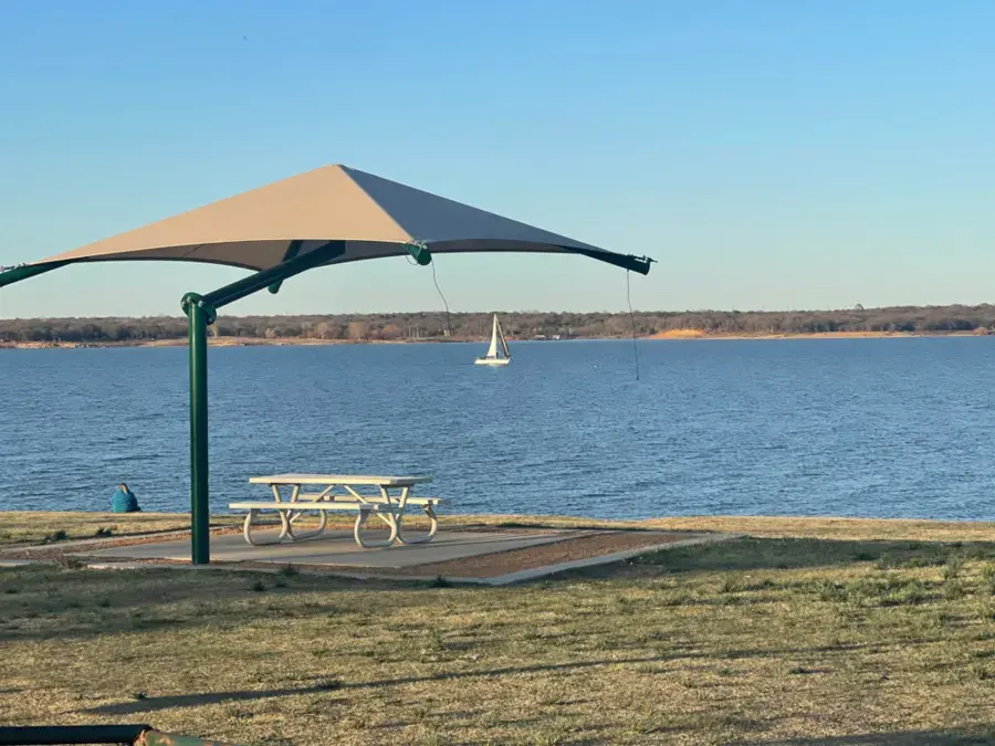 Grapevine Lake shoreline with a shade shelter near Flower Mound